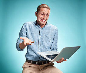 Image showing Sad Young Man Working On Laptop