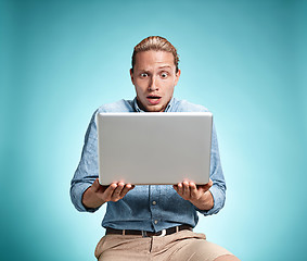 Image showing Sad Young Man Working On Laptop