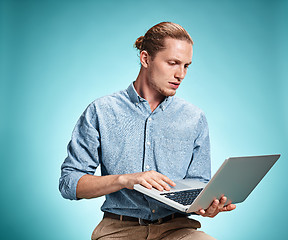 Image showing Sad Young Man Working On Laptop