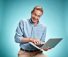 Image showing Sad Young Man Working On Laptop