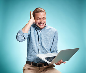 Image showing Sad Young Man Working On Laptop