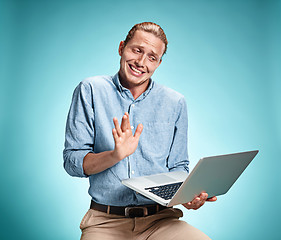 Image showing Sad Young Man Working On Laptop