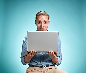 Image showing Sad Young Man Working On Laptop