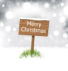 Image showing Snow covered wooden billboard, Christmas snowflakes background