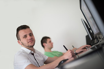 Image showing a group of graphic designers at work