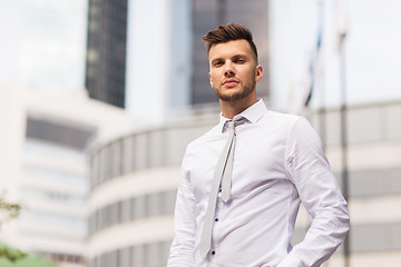 Image showing young man in shirt and tie on city street