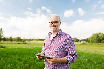 Image showing senior man with tablet pc computer at county