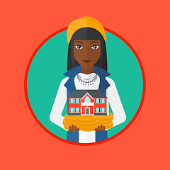 Image showing Woman holding house model vector illustration.