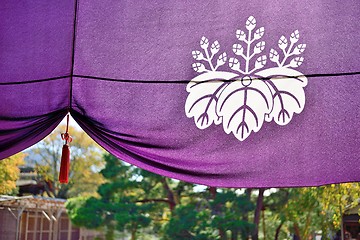 Image showing Purple Japanese temple curtain with historical emblem of Toyotomi clan.
