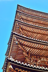 Image showing Five-storied pagoda roofs and blue sky.