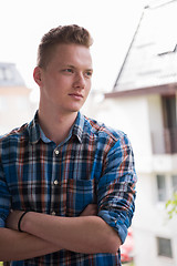 Image showing man standing at balcony