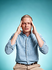 Image showing Tired businessman with headache emotions