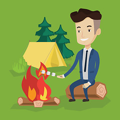 Image showing Businessman roasting marshmallow over campfire.