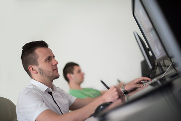 Image showing a group of graphic designers at work