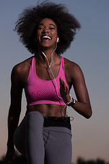 Image showing black woman is doing stretching exercise relaxing and warm up