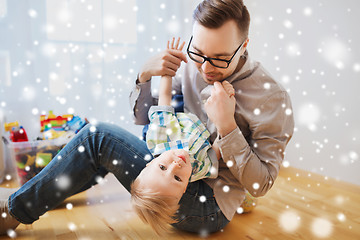 Image showing father with son playing and having fun at home