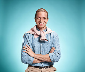 Image showing Happy excite young man smiling over blue background