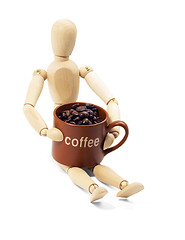 Image showing wood mannequin and coffee