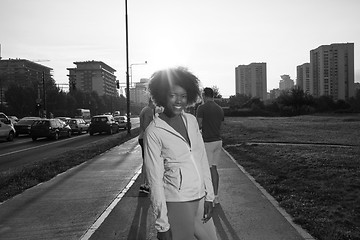 Image showing Portrait of sporty young african american woman running outdoors