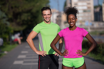 Image showing portrait of young multietnic jogging couple ready to run