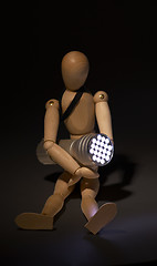 Image showing wood mannequin and flashlight