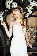 Image showing beauty young bride alone in luxury vintage interior with a lot of flowers close up