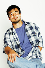 Image showing young cute asian man on white background gesturing emotional, po