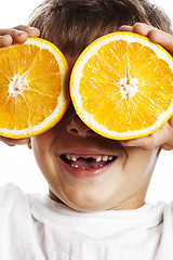 Image showing little cute boy with orange fruit double isolated on white smili