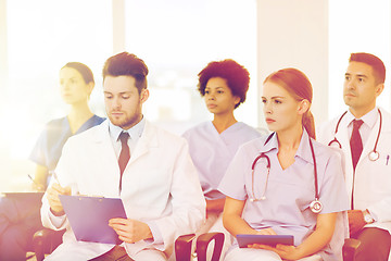 Image showing group of happy doctors on seminar at hospital