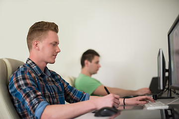 Image showing a group of graphic designers at work