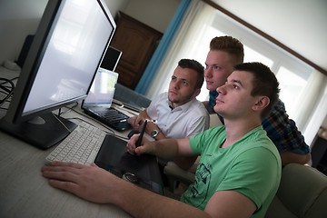 Image showing a group of graphic designers at work