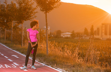 Image showing Portrait of a young african american woman running outdoors