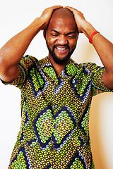 Image showing portrait of young handsome african man wearing bright green nati