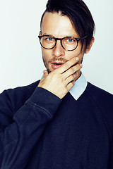 Image showing handsome middle age hipster man with modern hairstyle and tattoo, beard, close up on white background