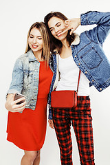 Image showing best friends teenage girls together having fun, posing emotional on white background, besties happy smiling, lifestyle people concept