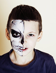 Image showing little cute boy with facepaint like skeleton to celebrate hallow