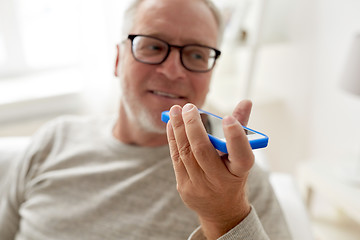 Image showing old man using voice command recorder on smartphone