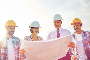 Image showing group of builders and architects with blueprint