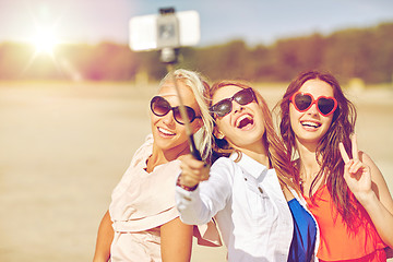 Image showing group of smiling women taking selfie on beach