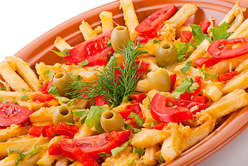 Image showing golden French fries potatoes with tomato and olive