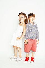 Image showing little cute boy and girl hugging playing on white background, happy smiling family, lifestyle people concept