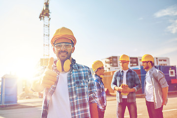 Image showing builders showing thumbs up at construction site