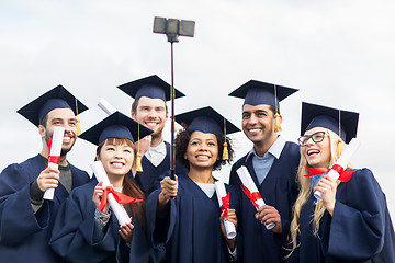 Image showing students or bachelors taking selfie by smartphone