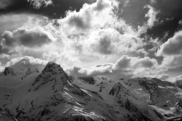 Image showing Black and white snow mountains in clouds