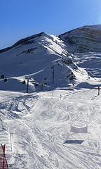 Image showing Ski slope and gondola lift at sun winter evening