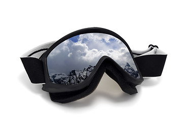 Image showing Ski goggles with reflection of winter snow mountains