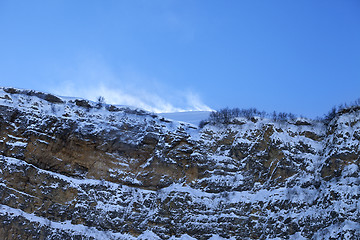 Image showing Rocks in snow at wind winter evening