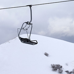 Image showing Chair lift and gray sky at evening