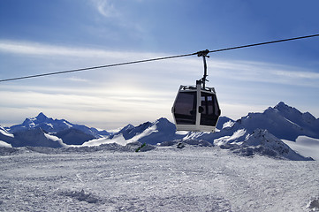 Image showing Ski lift in snow winter mountains at evening