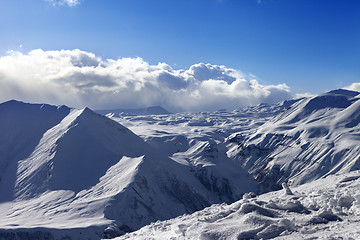 Image showing Speed flying in sunny winter mountains